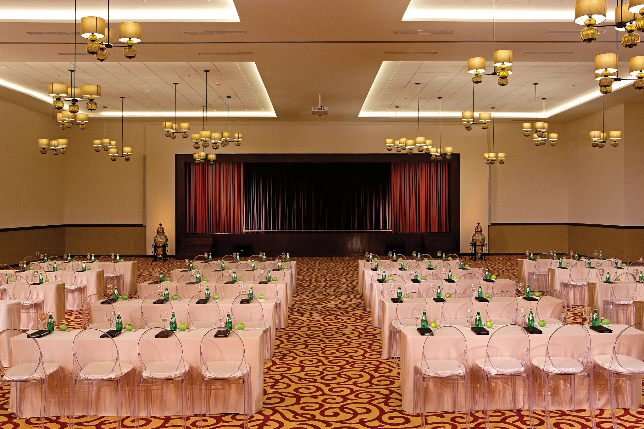 Ballroom theater-style meeting setup with stage at Secrets Puerto Los Cabos