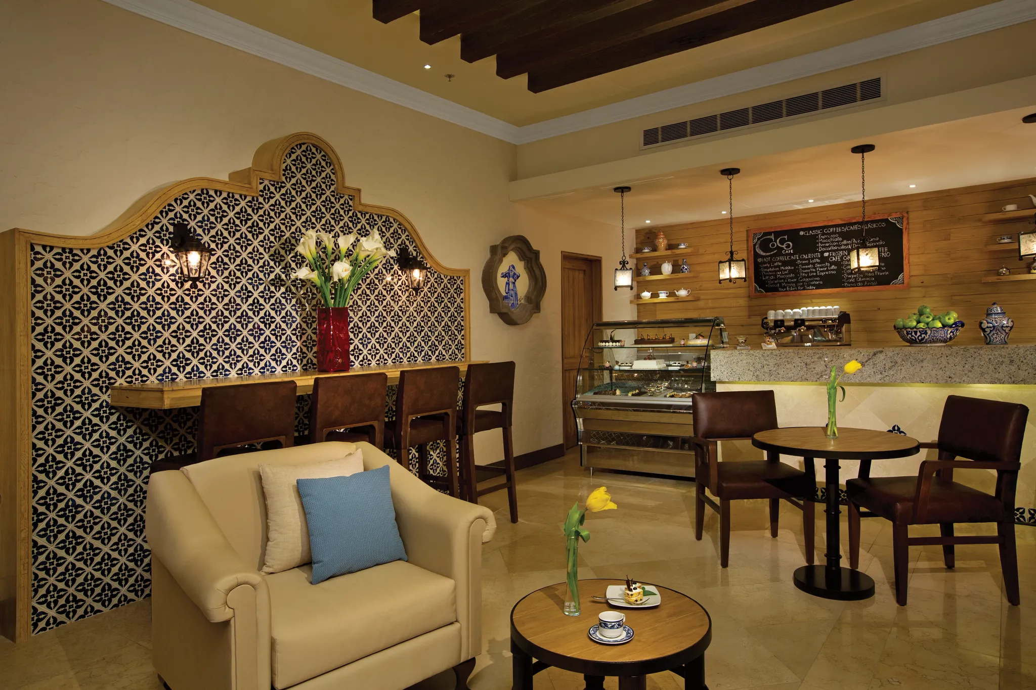Coco Café at Secrets Puerto Los Cabos featuring a cozy coffee shop, espresso drinks, pastries, and casual lounge seating.