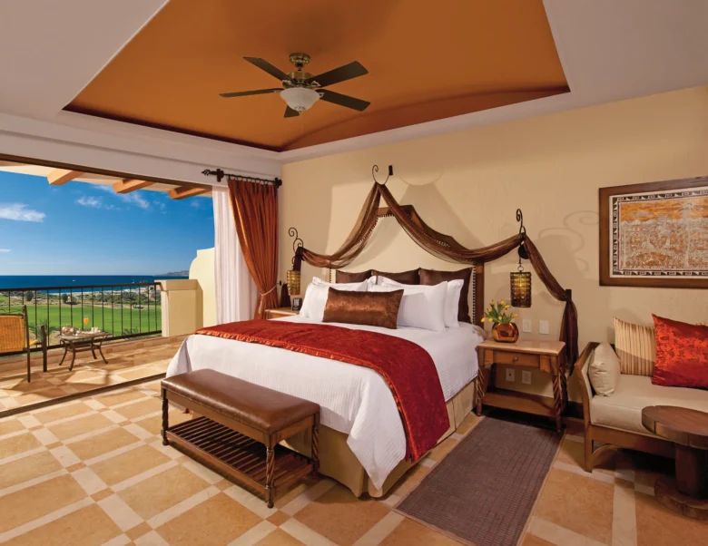 Junior Suite Ocean View with king bed and private balcony overlooking the ocean at Secrets Puerto Los Cabos Resort.
