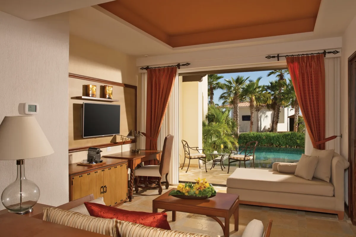 Master Suite Swim Out living area with terrace and pool access at Secrets Puerto Los Cabos Golf & Spa Resort.