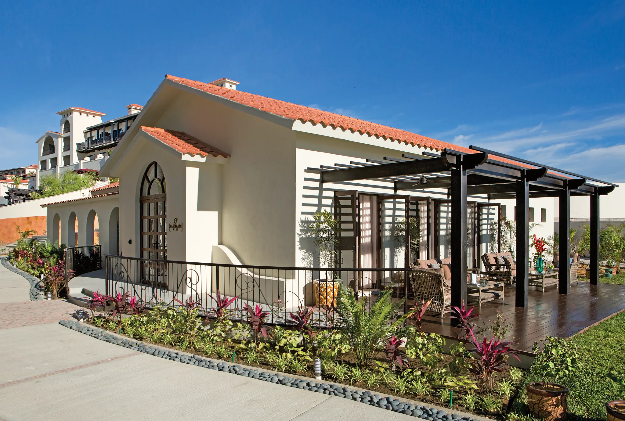 Preferred Club building with terrace and modern Mexican architecture at Secrets Puerto Los Cabos.