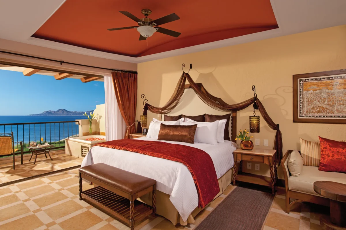 Preferred Club Junior Suite Ocean Front with king bed and oceanfront balcony at Secrets Puerto Los Cabos Resort.