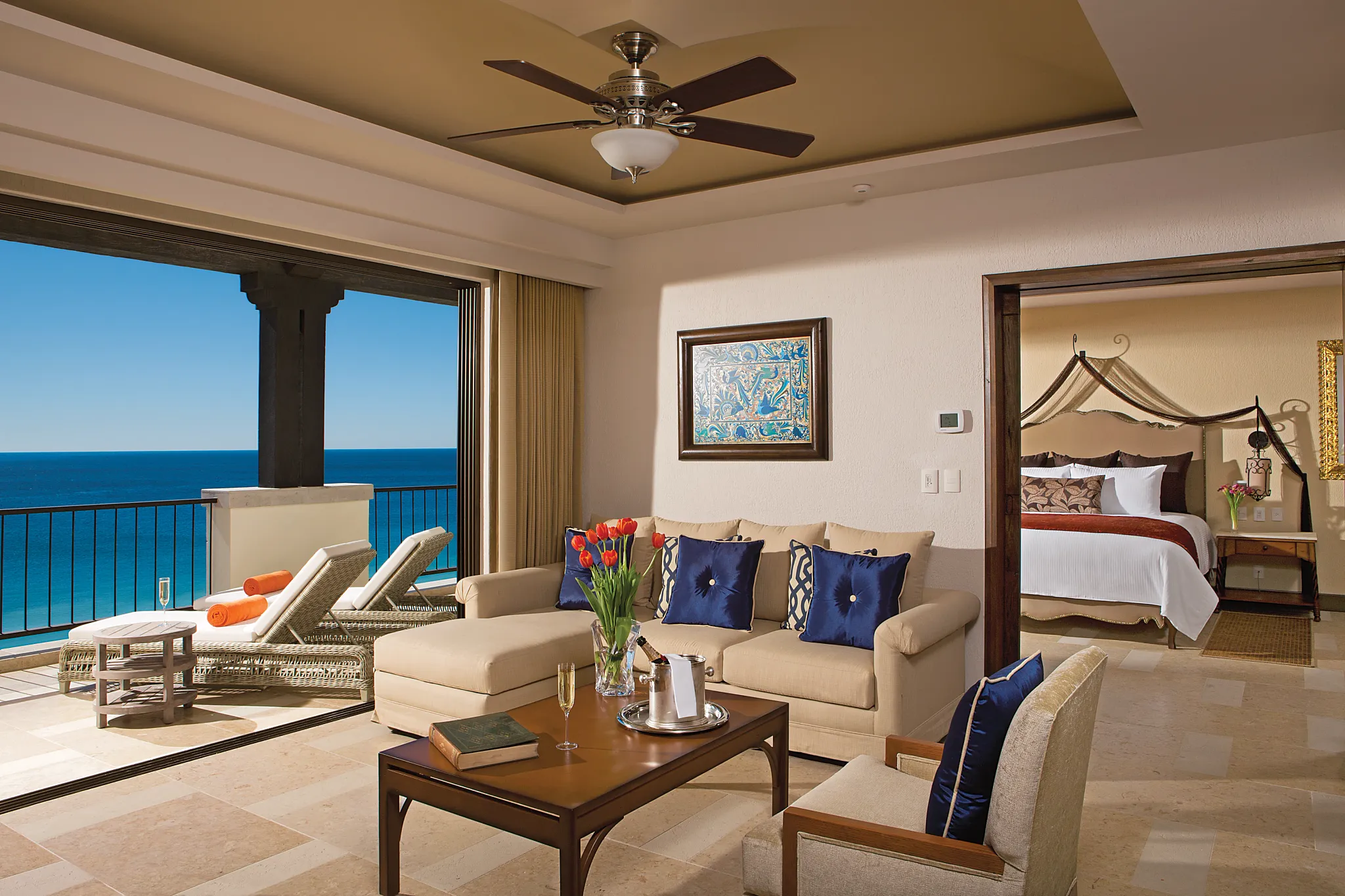 Presidential Suite living area with oceanview balcony at Secrets Puerto Los Cabos Golf & Spa Resort.